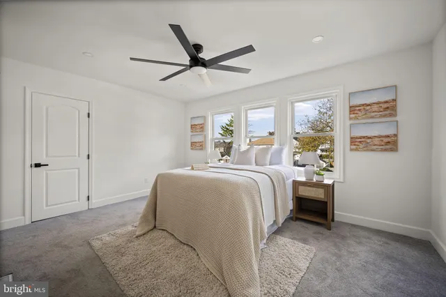 a view of a house with a wooden deck
