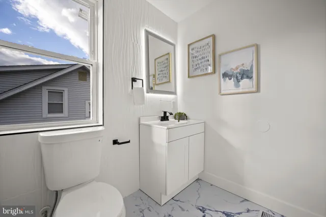 a front view of a house with a wooden fence