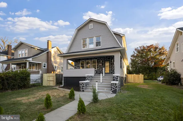 a living room with fireplace furniture and a flat screen tv
