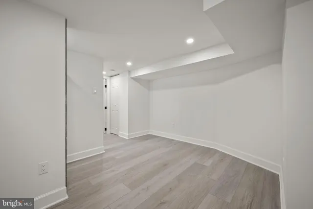 an aerial view of a residential apartment building with a yard