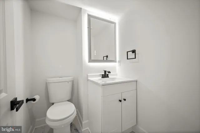 an aerial view of residential houses with yard