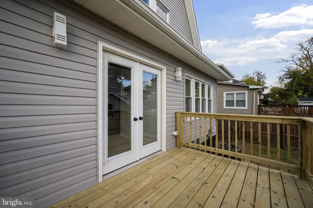 a picture of a bench in front of a wall