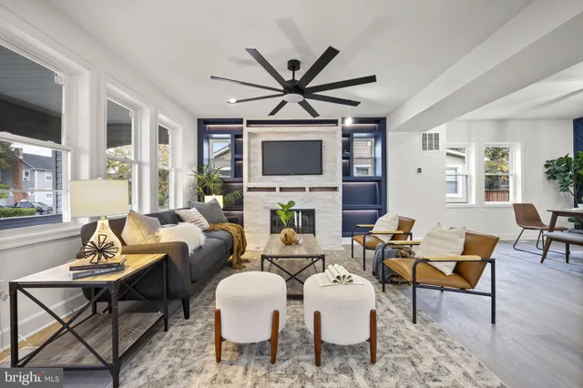 a view of a dining room with furniture and a potted plant