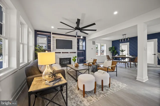 a kitchen with stainless steel appliances granite countertop a sink a stove a refrigerator and island