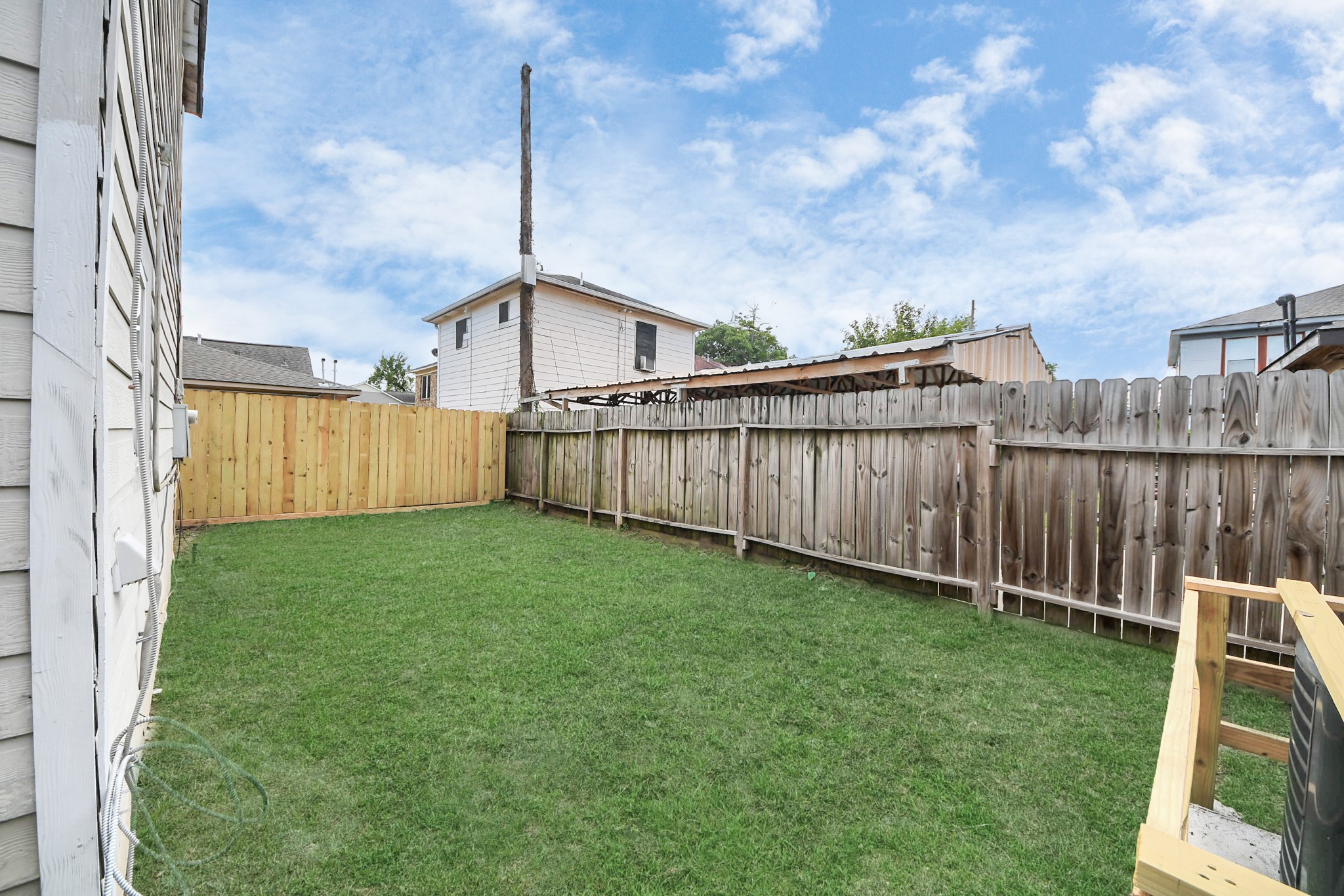 2902 Truxillo Street Houston, TX 77004 - Photo 31 of 32 a view of a backyard with wooden fence