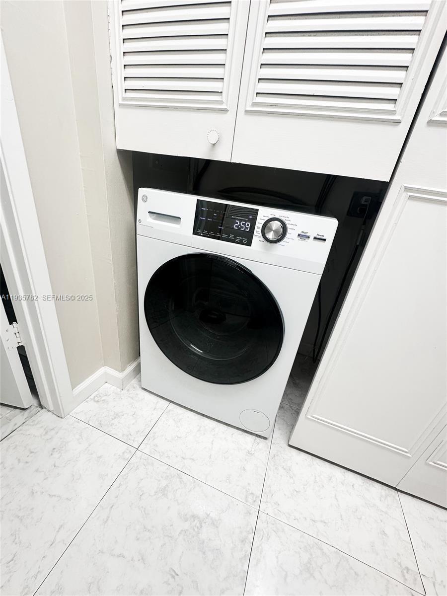1401 South Federal Highway, Unit 122 Boca Raton, FL 33432 - Photo 13 of 20 a utility room with dryer and washer