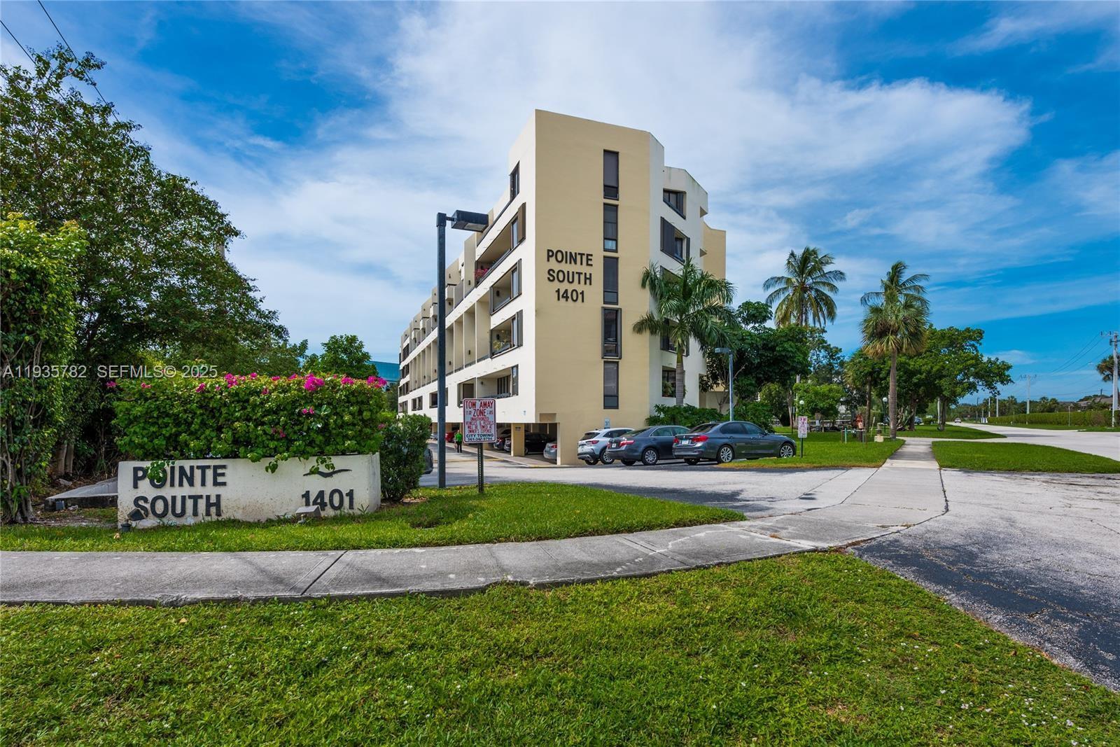 1401 South Federal Highway, Unit 122 Boca Raton, FL 33432 - Photo 16 of 20 a front view of a house with a yard and garage