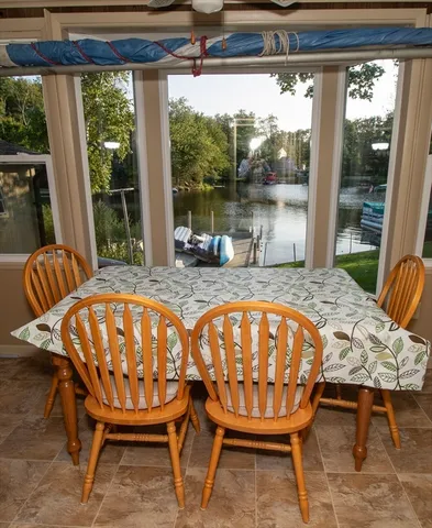 a view of a dining room with furniture window and outside view