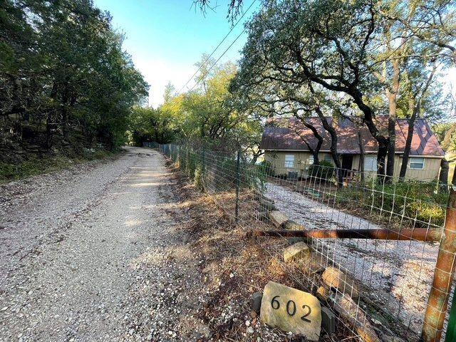 602 Sycamore Road Burnet, TX 78611 - Photo 3 of 26 a backyard of a house with lots of green space