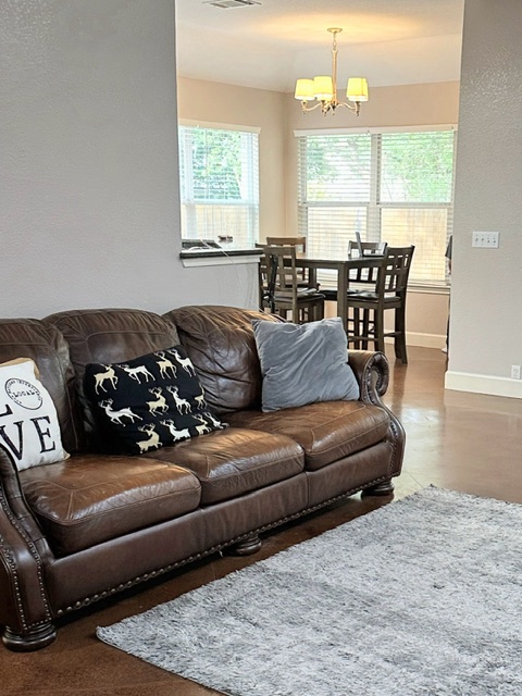 2224 Kerr Trail Cedar Park, TX 78613 - Photo 5 of 15 a living room with furniture with a table and chairs
