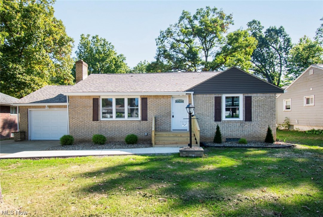 1097 South Meridian Road Youngstown, OH 44511 - Photo 1 of 29 Ranch-style house featuring a front yard and a garage