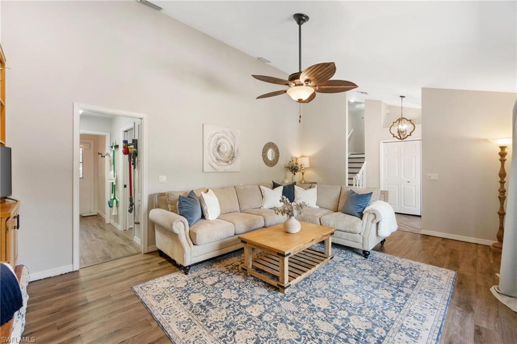 1041 29th Street Southwest Naples, FL 34117 - Photo 11 of 50 a living room with furniture and wooden floor