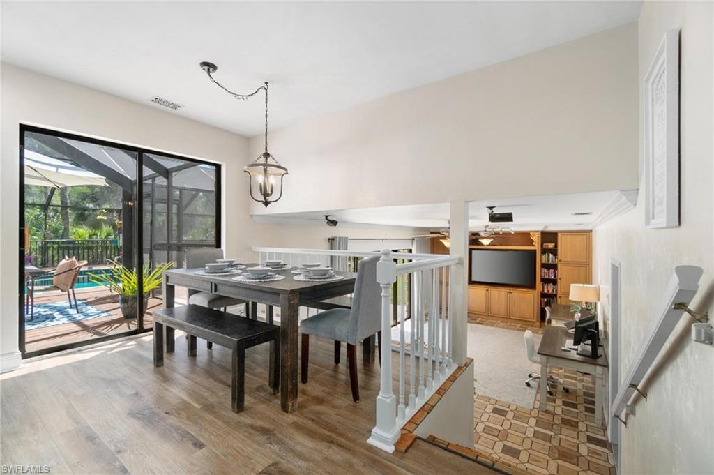 1041 29th Street Southwest Naples, FL 34117 - Photo 17 of 50 a view of a dining room with furniture window and wooden floor