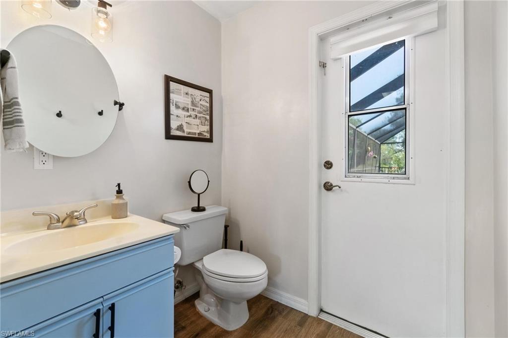 1041 29th Street Southwest Naples, FL 34117 - Photo 19 of 50 a bathroom with a toilet sink and mirror