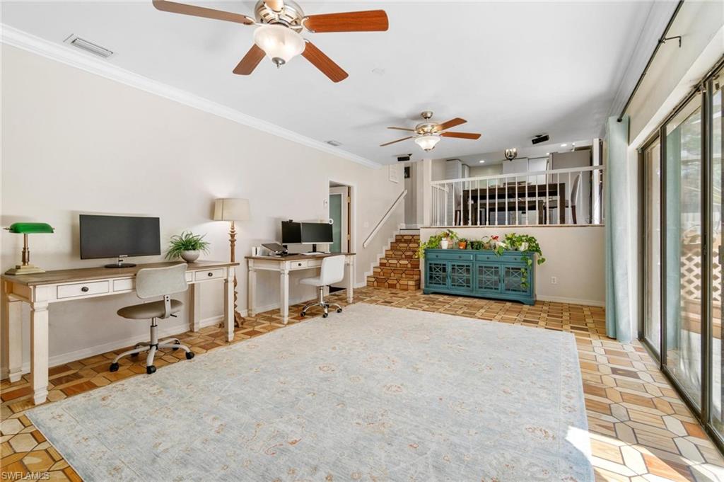 1041 29th Street Southwest Naples, FL 34117 - Photo 20 of 50 a view of a livingroom with a workspace and a window
