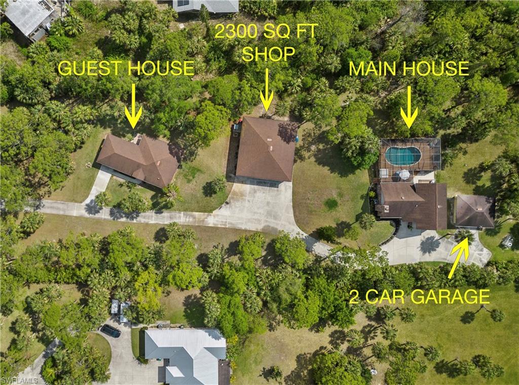1041 29th Street Southwest Naples, FL 34117 - Photo 2 of 50 an aerial view of residential house with outdoor space and trees all around