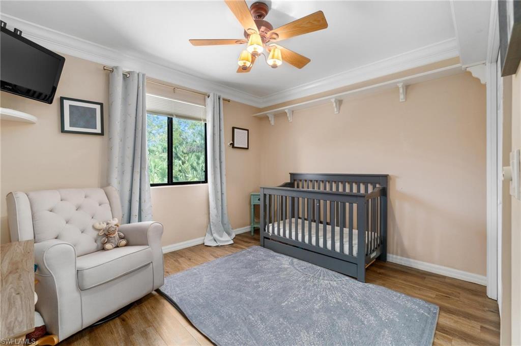 1041 29th Street Southwest Naples, FL 34117 - Photo 26 of 50 a bedroom with furniture and a window