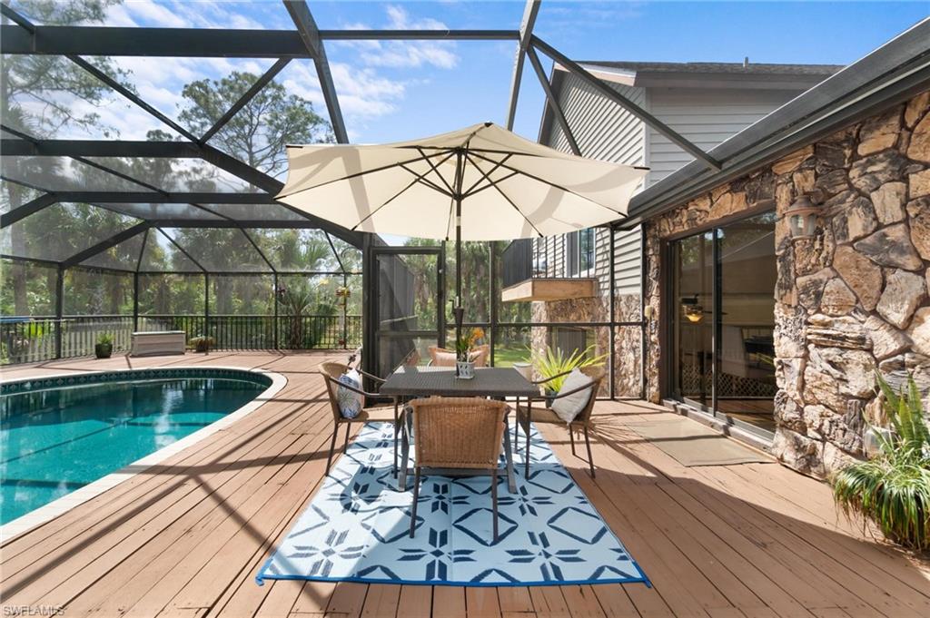 1041 29th Street Southwest Naples, FL 34117 - Photo 31 of 50 a view of a swimming pool with a patio