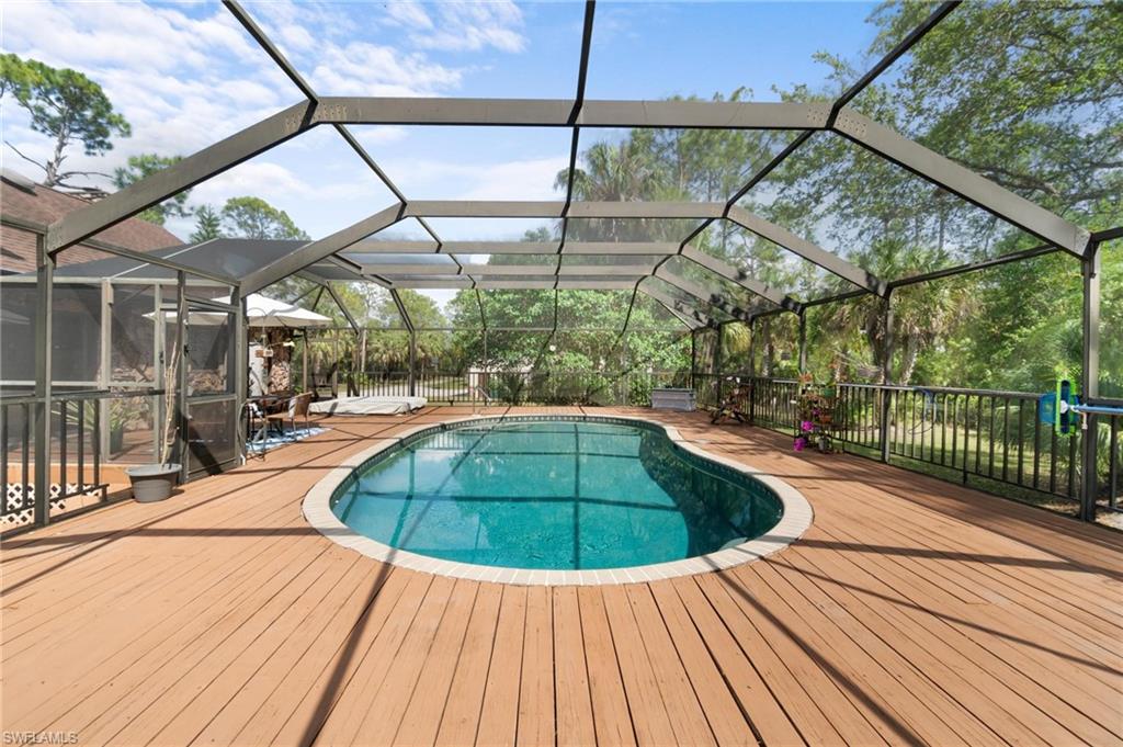 1041 29th Street Southwest Naples, FL 34117 - Photo 33 of 50 a view of outdoor space with swimming pool