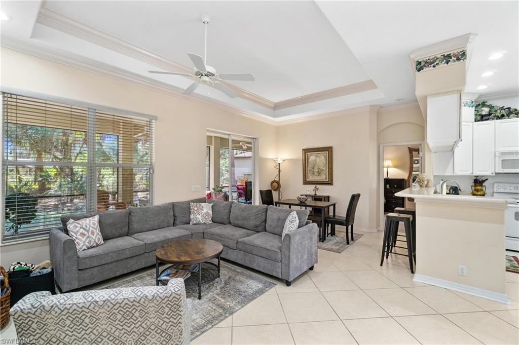 1041 29th Street Southwest Naples, FL 34117 - Photo 35 of 50 a living room with furniture and a large window