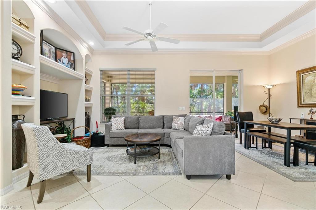 1041 29th Street Southwest Naples, FL 34117 - Photo 37 of 50 a living room with furniture and a large window