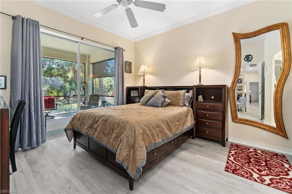 1041 29th Street Southwest Naples, FL 34117 - Photo 40 of 50 a bed sitting in a spacious bedroom next to a window
