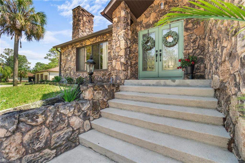 1041 29th Street Southwest Naples, FL 34117 - Photo 4 of 50 a view of garden entrance