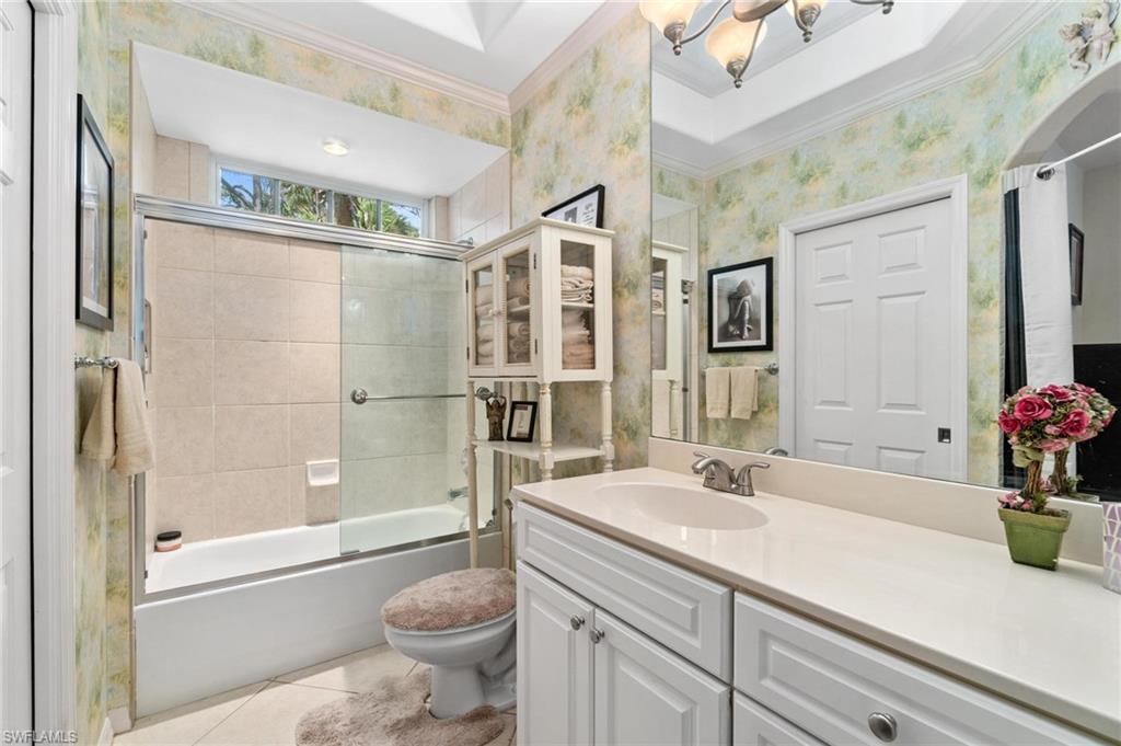 1041 29th Street Southwest Naples, FL 34117 - Photo 41 of 50 a bathroom with a sink a toilet and shower