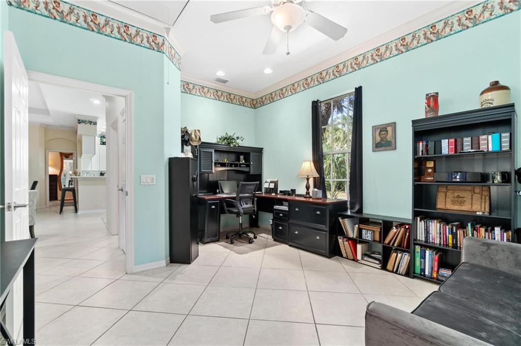 1041 29th Street Southwest Naples, FL 34117 - Photo 43 of 50 a living room with furniture and a flat screen tv
