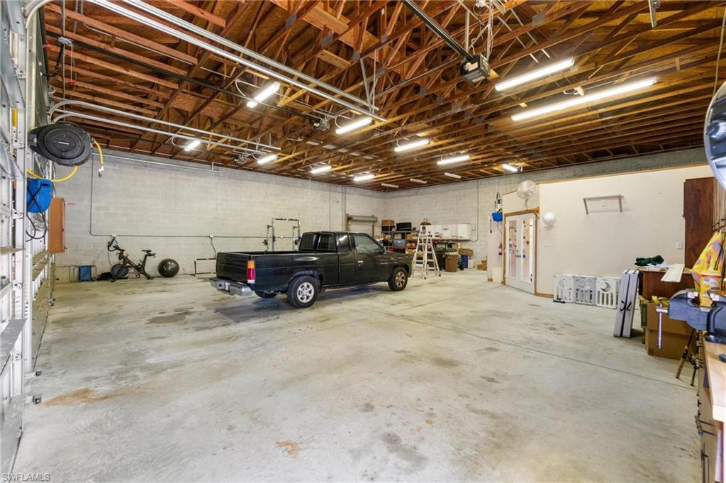 1041 29th Street Southwest Naples, FL 34117 - Photo 50 of 50 a view of parking garage with cars