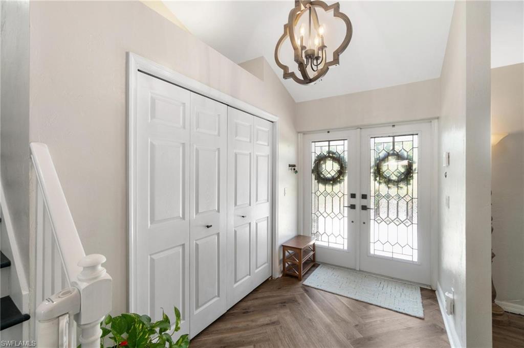 1041 29th Street Southwest Naples, FL 34117 - Photo 9 of 50 a view of an entryway with wooden floor