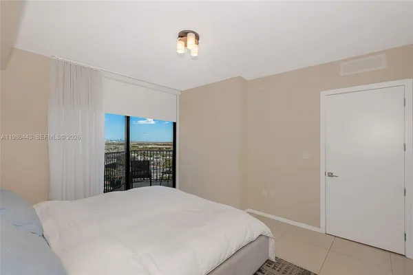 a bathroom with a double vanity sink a toilet and a mirror