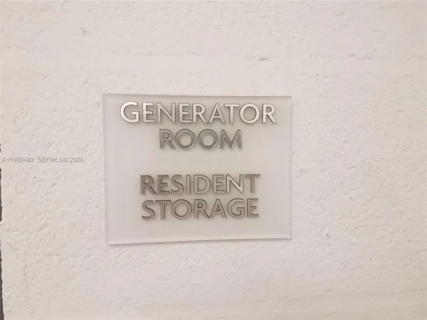 a living room with lots of furniture a rug and white walls