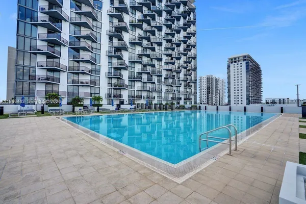 a lobby with furniture and outdoor view