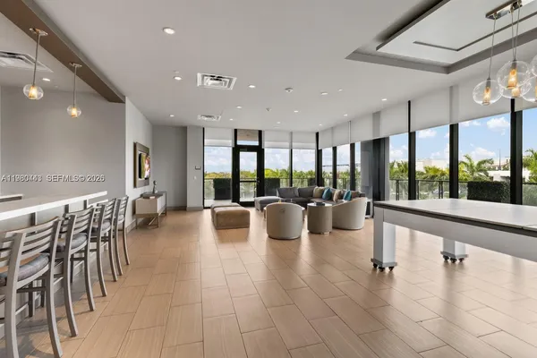 a front view of multi story building with retail shops