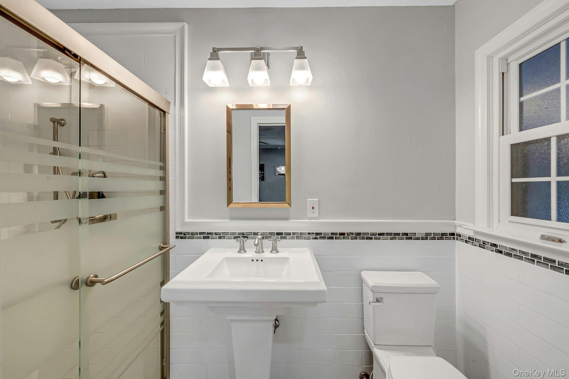 155 Hilburn Road Scarsdale, NY 10583 - Photo 14 of 35 a bathroom with a sink and mirror with toilet