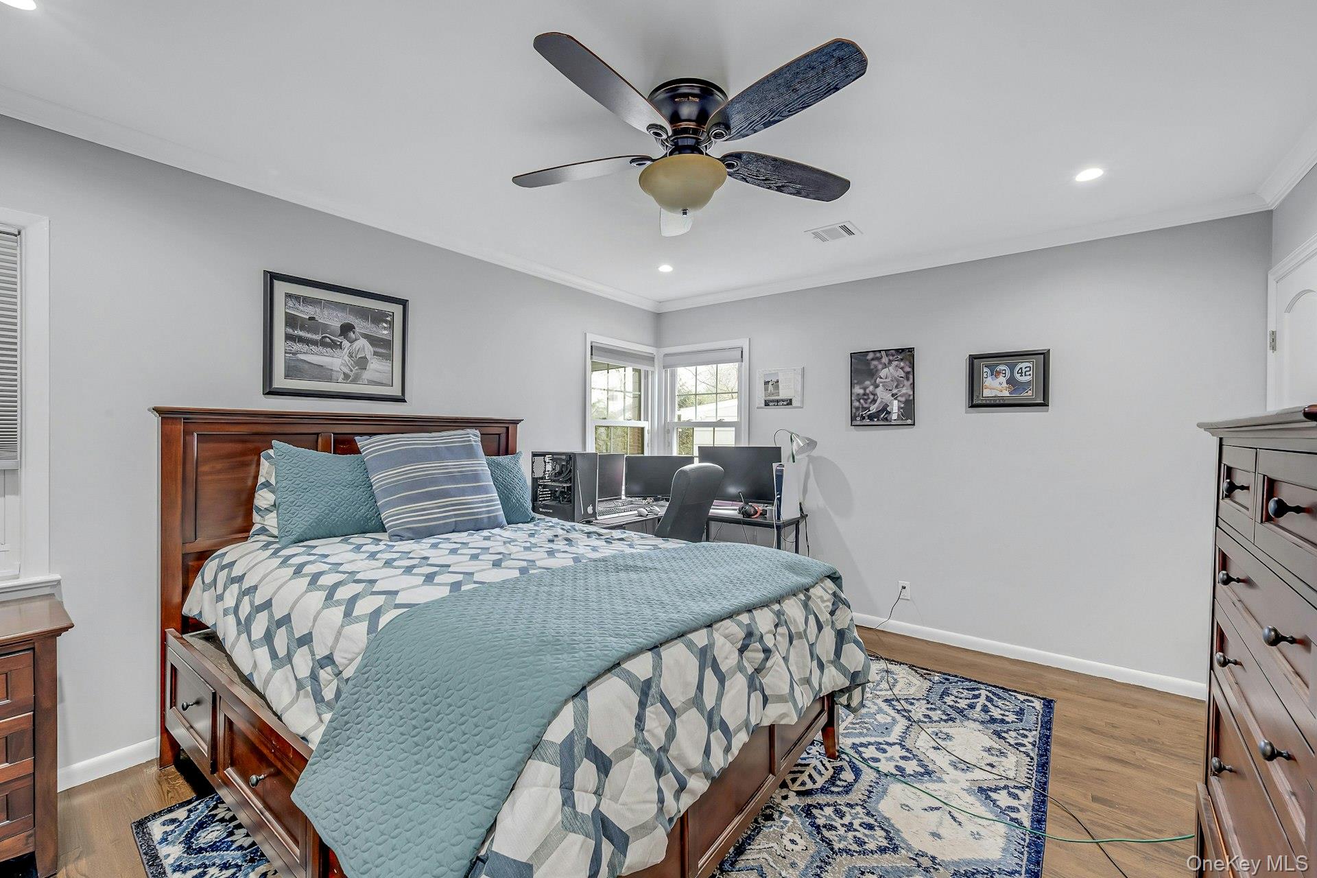 155 Hilburn Road Scarsdale, NY 10583 - Photo 15 of 35 a bedroom with a large bed and a chandelier