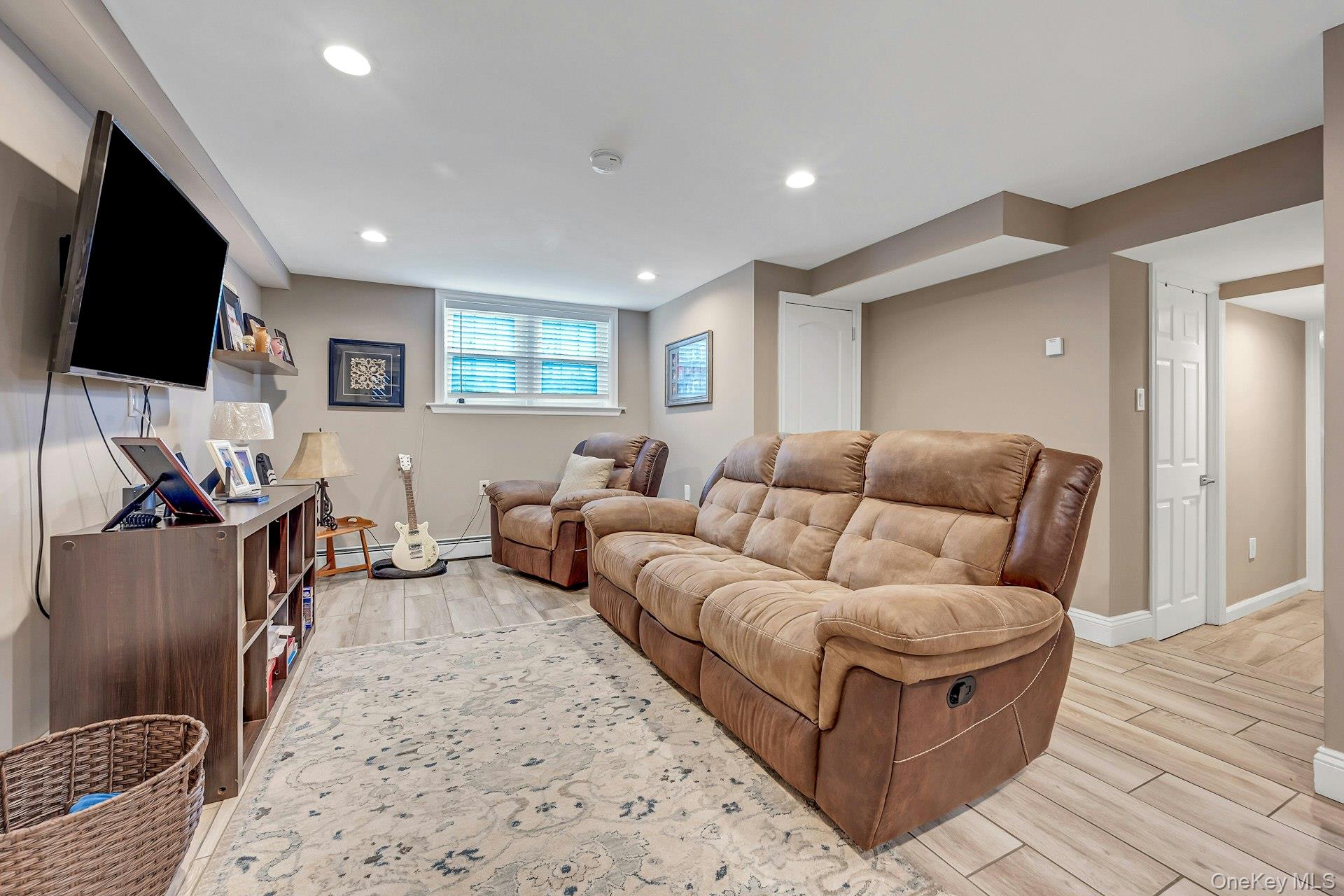155 Hilburn Road Scarsdale, NY 10583 - Photo 22 of 35 a living room with furniture and a flat screen tv
