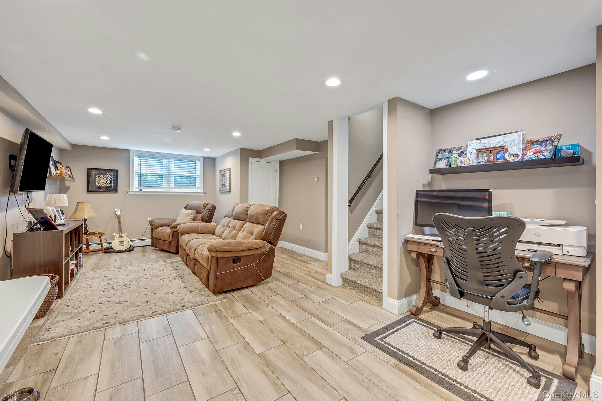 155 Hilburn Road Scarsdale, NY 10583 - Photo 23 of 35 a living room with furniture and a flat screen tv