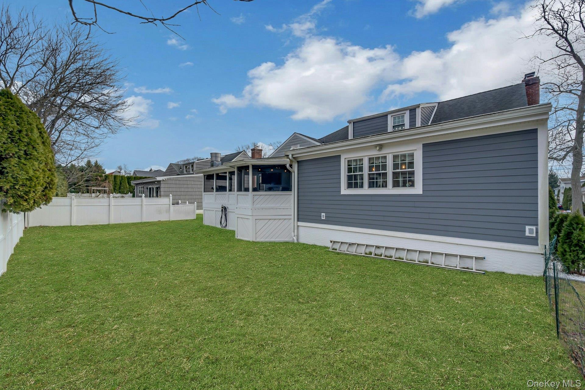 155 Hilburn Road Scarsdale, NY 10583 - Photo 28 of 35 a view of a house with a yard and sitting area