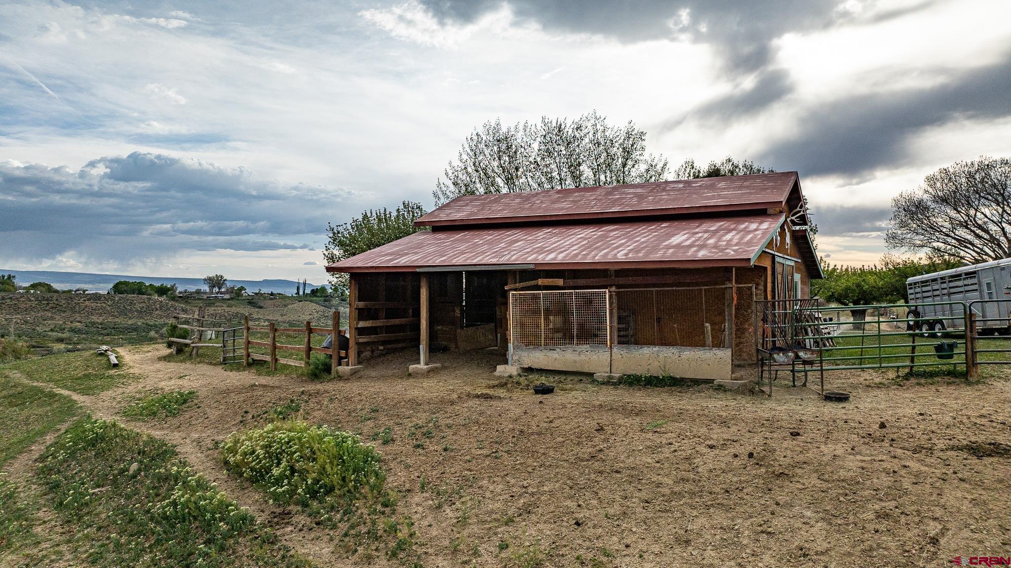 37760 Back River Road Paonia, CO 81428 - Photo 12 of 38 a view of a house with a yard and sitting area