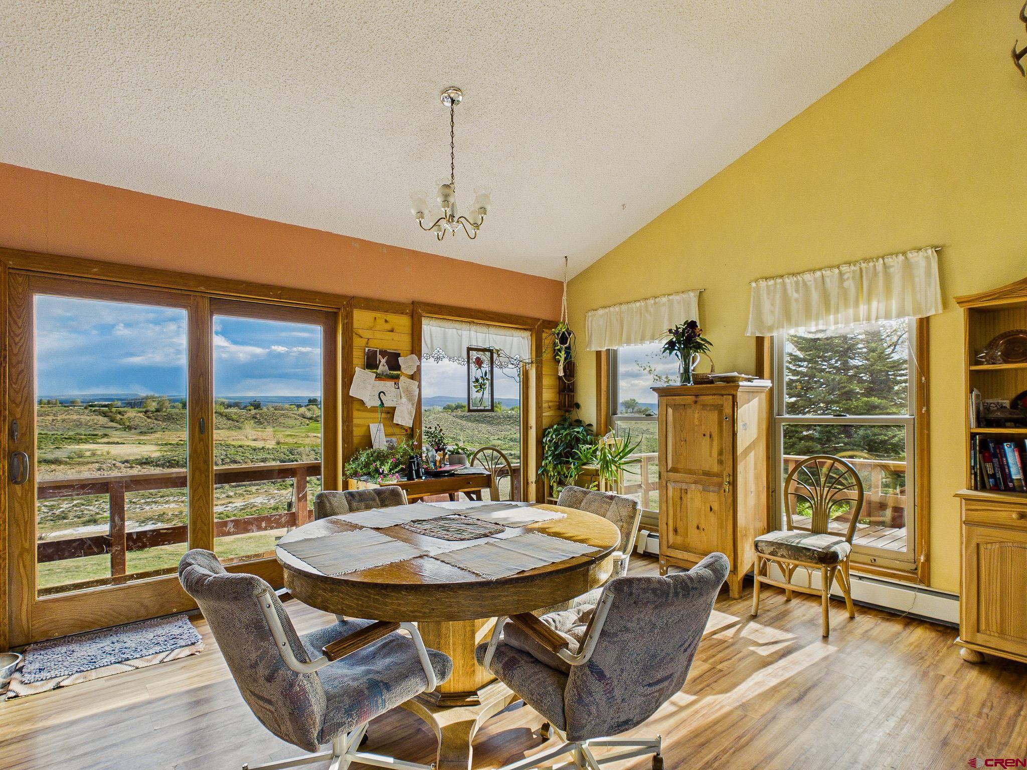 37760 Back River Road Paonia, CO 81428 - Photo 19 of 38 a view of a dining room with furniture window and wooden floor