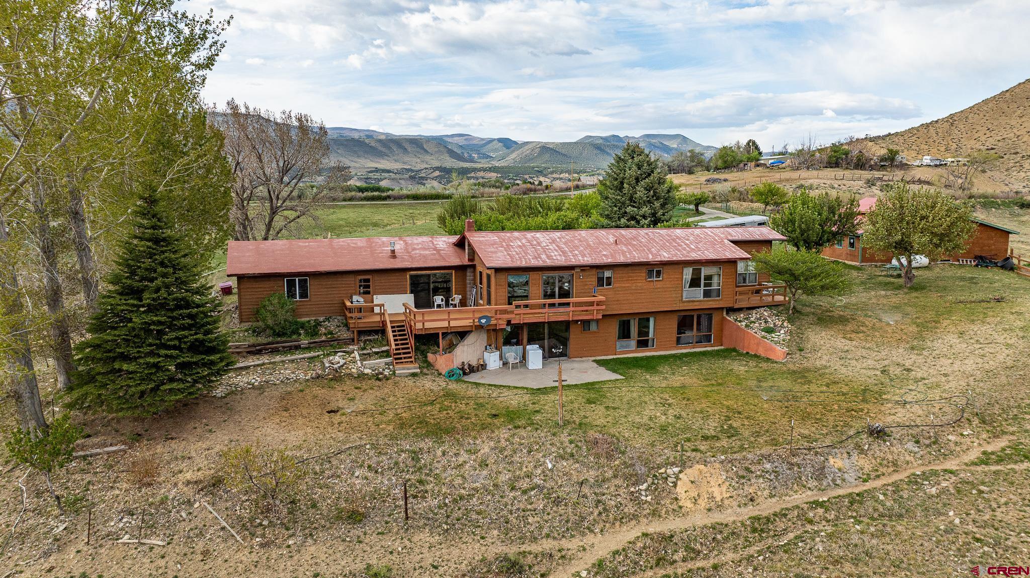 37760 Back River Road Paonia, CO 81428 - Photo 3 of 38 an aerial view of a house with swimming pool and a yard
