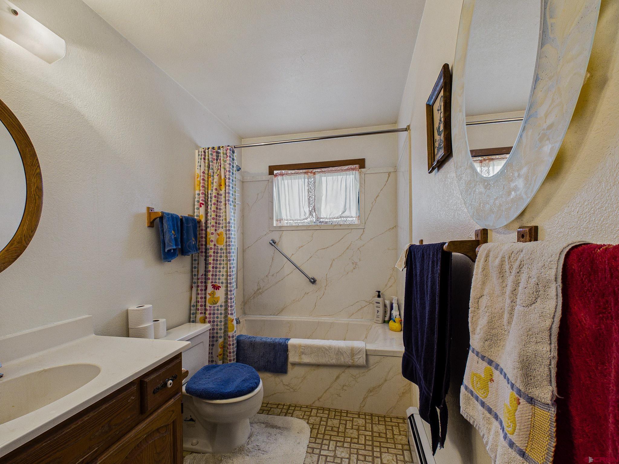37760 Back River Road Paonia, CO 81428 - Photo 35 of 38 a bathroom with a sink toilet and shower