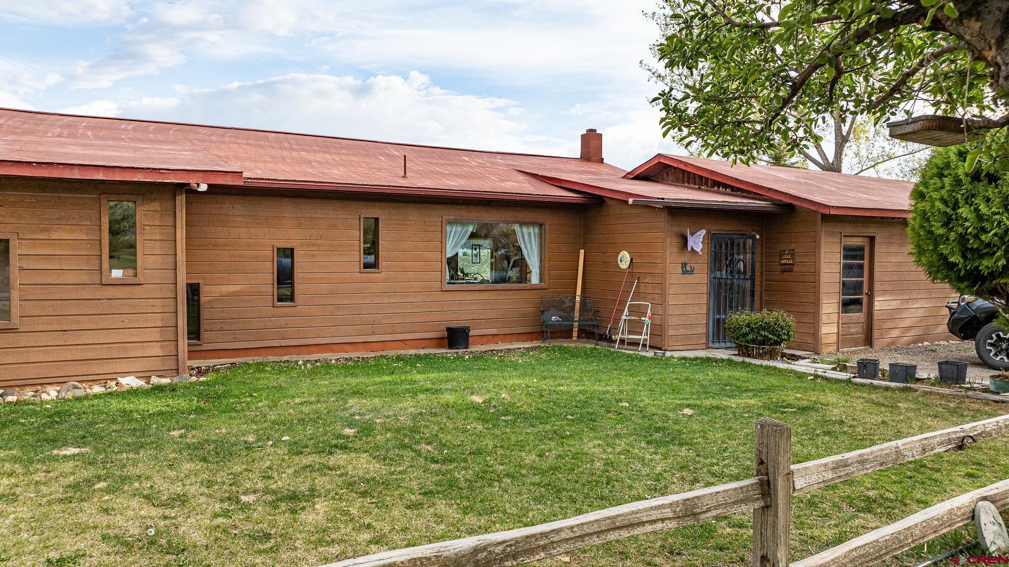 37760 Back River Road Paonia, CO 81428 - Photo 4 of 38 a front view of a house with a yard