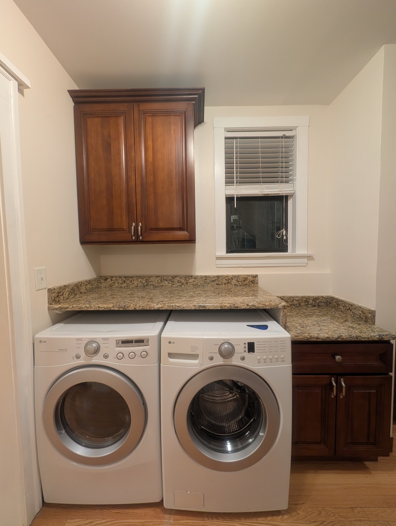 1419 East 56th Street, Unit 1 Chicago, IL 60637 - Photo 12 of 35 a utility room with sink dryer and washer