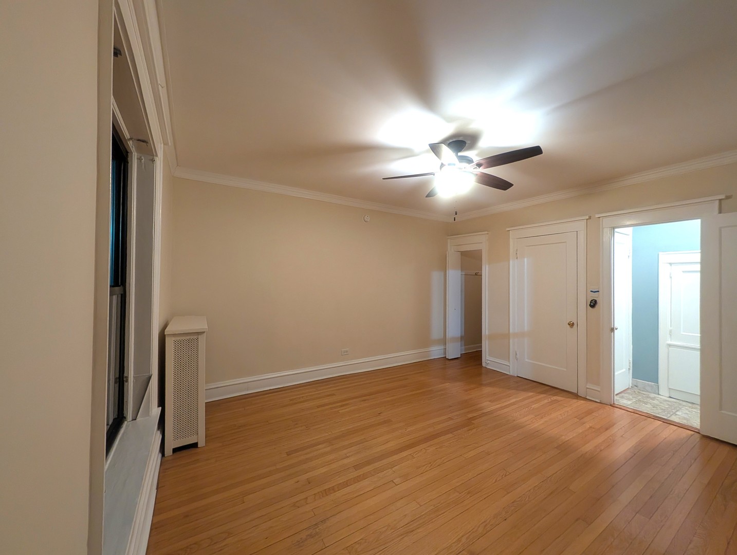 1419 East 56th Street, Unit 1 Chicago, IL 60637 - Photo 18 of 35 wooden floor in an empty room