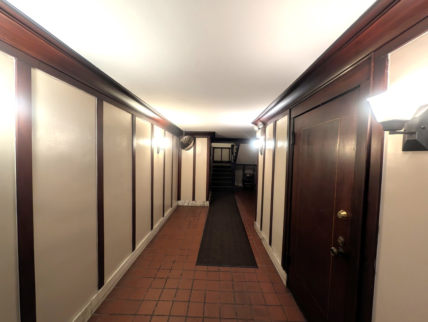 1419 East 56th Street, Unit 1 Chicago, IL 60637 - Photo 3 of 35 a hallway with sliding door and a window