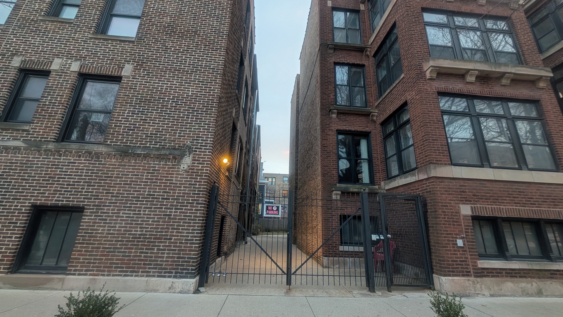 1419 East 56th Street, Unit 1 Chicago, IL 60637 - Photo 33 of 35 a brick building with a door and a window