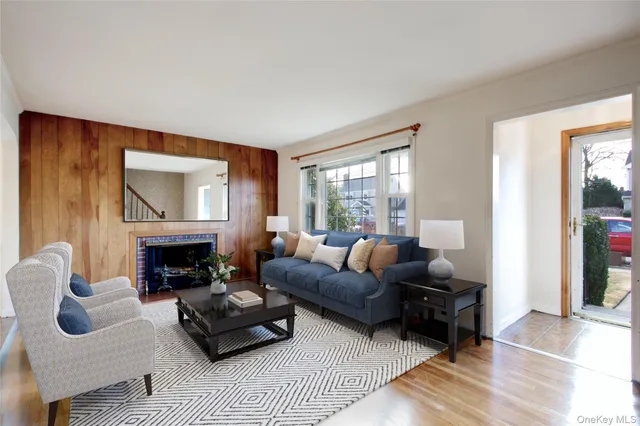 a living room with furniture flat screen tv and a fireplace